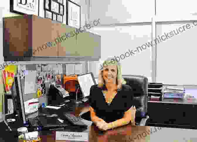 A Pensive High School Principal Sitting At Her Desk, Reflecting On Her Experiences. Reflections Of An Urban High School Principal
