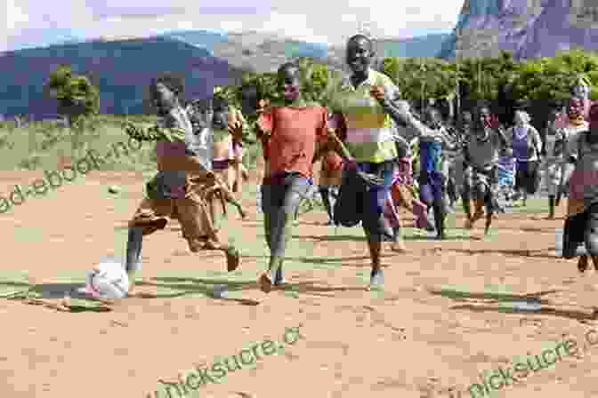 Children In Rural Kenya Playing With A Soccer Ball Barefoot Pawprint: A Kenya Childhood