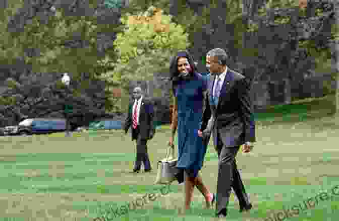 Michelle Obama And President Barack Obama Walk Hand In Hand Across The South Lawn Of The White House. Chasing Light: Michelle Obama Through The Lens Of A White House Photographer