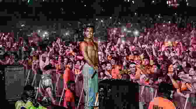 XXXTentacion Performing On Stage, With A Crowd Of Fans In The Background. Look At Me : The XXXTENTACION Story